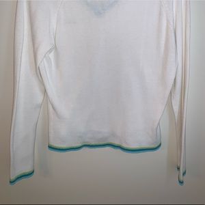 White sweater with blue accents